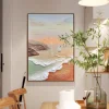 Coastal sunrise canvas art displayed in a modern dining room