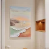 Hand-painted coastal wall art displayed in a neutral hallway
