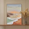 Coastal sailboat wall art shown in a styled room setting